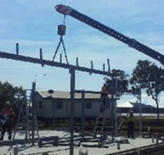 Crane Lifting Metal Beam — Cranes in Mackay, QLD