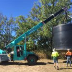 Crane Lifting a Tank — Cranes in Mackay, QLD